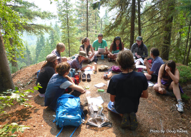 Participants discuss their project plans after a hike in the Fraser headwaters.