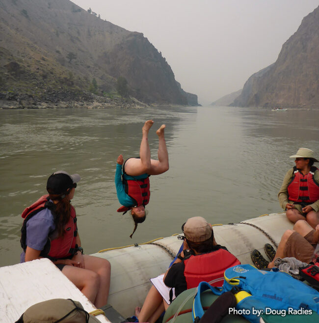 Sasha diving off the raft into the Fraser River.